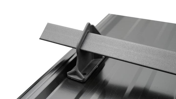 Exposed Fastener Stand mounted on a metal roof panel, holding a rail